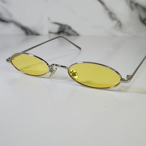 Sunglasses Oval Yellow Lens. Silver Metal Frame.